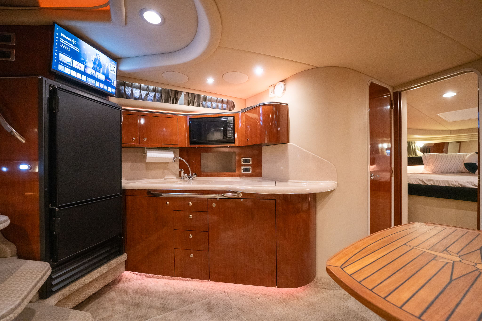 Below-deck cabin lounge seating with mirrored wall panels