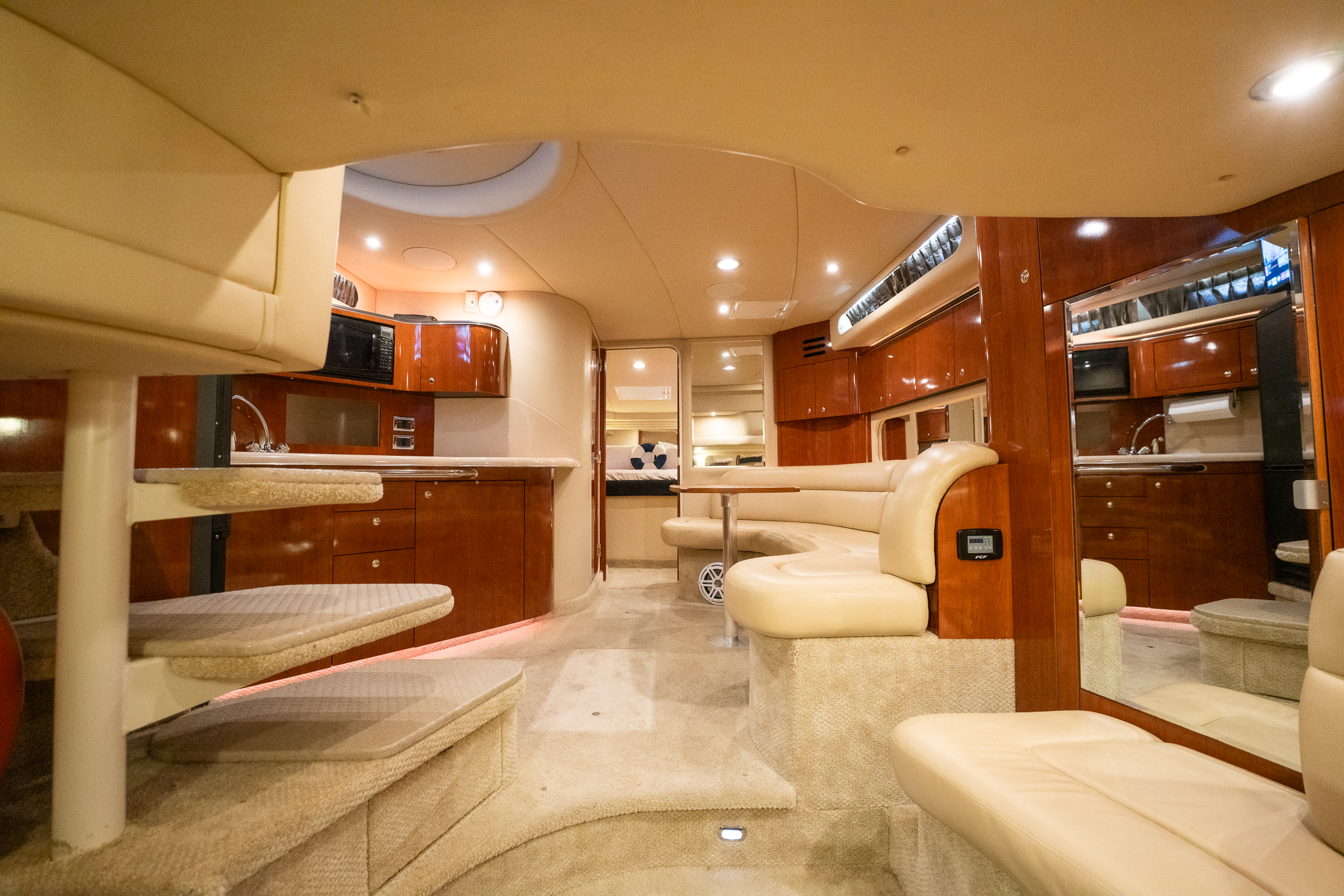 Cream leather salon seating with dining table below deck